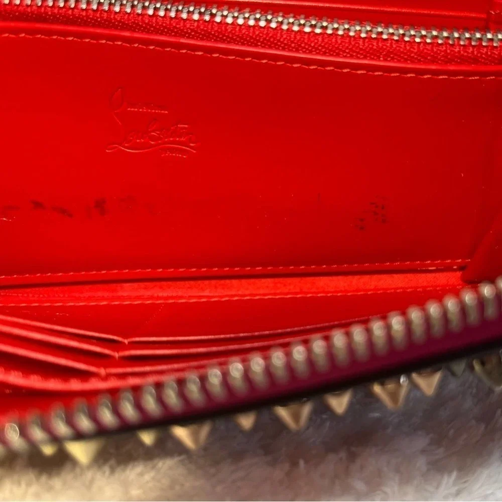 Christian Louboutin Zip Around Panetone Studded wallet in Wine Color, Leather